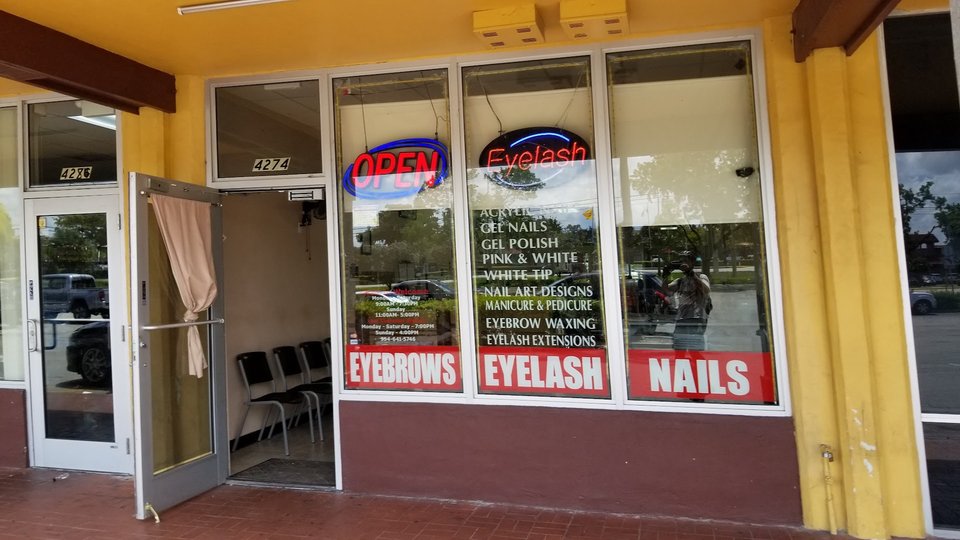 Nail salon stations with polish bottles and tools
